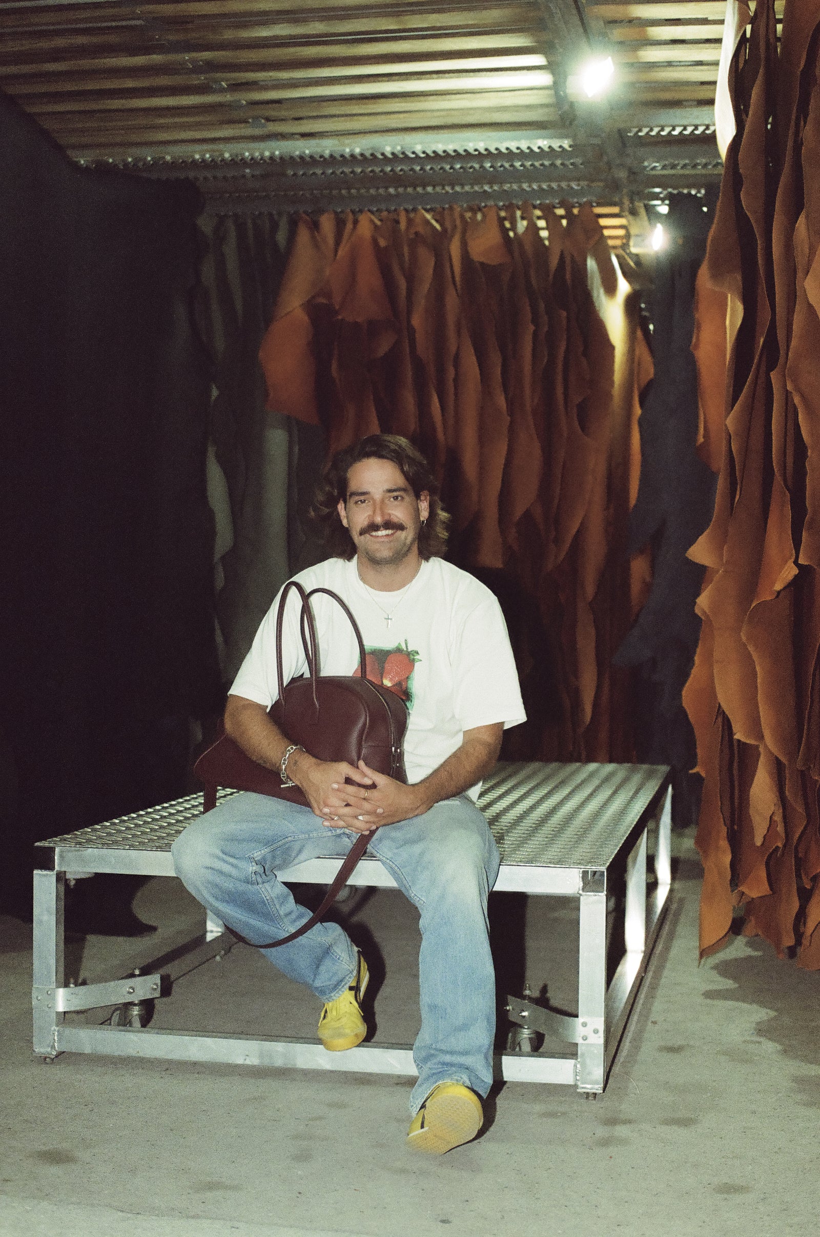 Guillaume Hiriart Carriat with a Black Cherry LUMA bag in the tannery