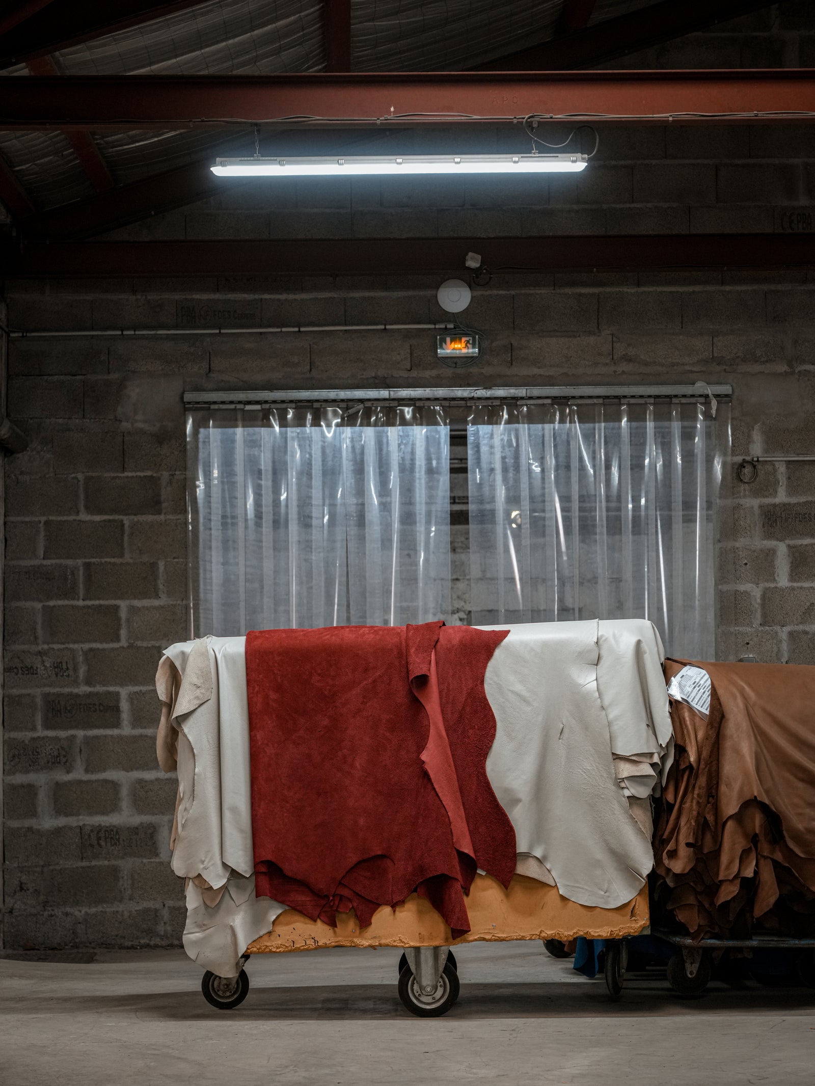 Red and ivory hides at a French tannery